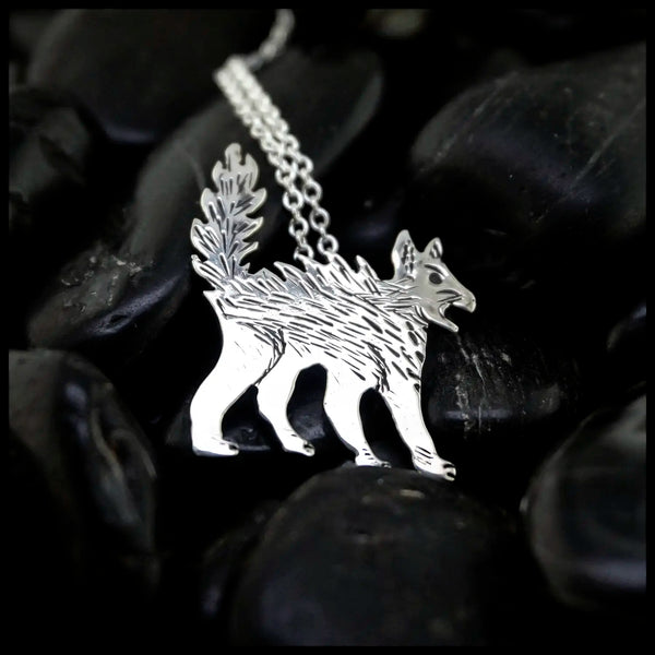 Silver Scaredy Cat pendant on a chain against a dark background