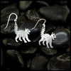 Silver Scaredy cat earrings on black pebbles