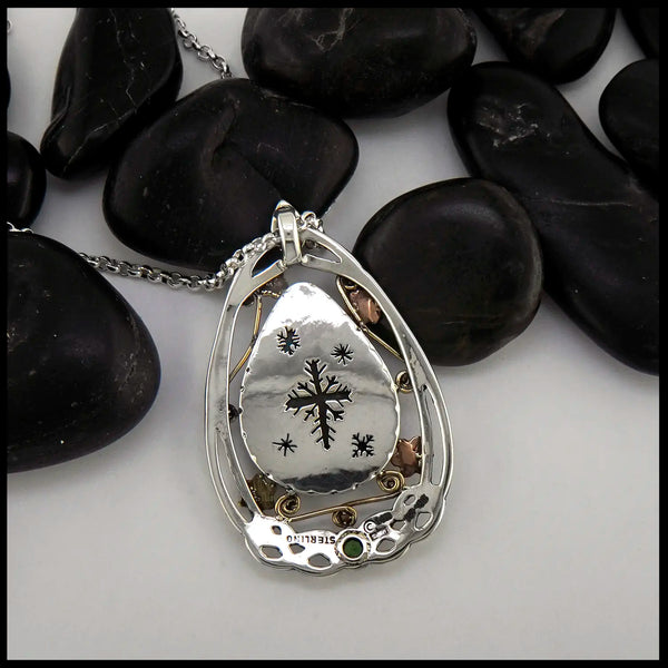 Cutout snowflake motifs on the reverse of the Sterling Silver Bezel setting