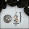 4mm Blue Topaz set in Sterling Silver  Pendant with 14K Rose Gold accents 
20mm x 15mm