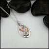 4mm Blue Topaz set in Sterling Silver  Pendant with 14K Rose Gold accents