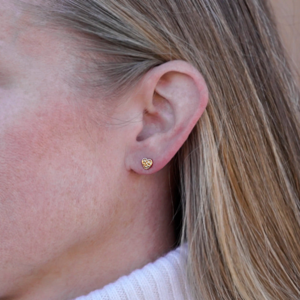 Robin's Heart post earring in 14K gold, worn on the ear