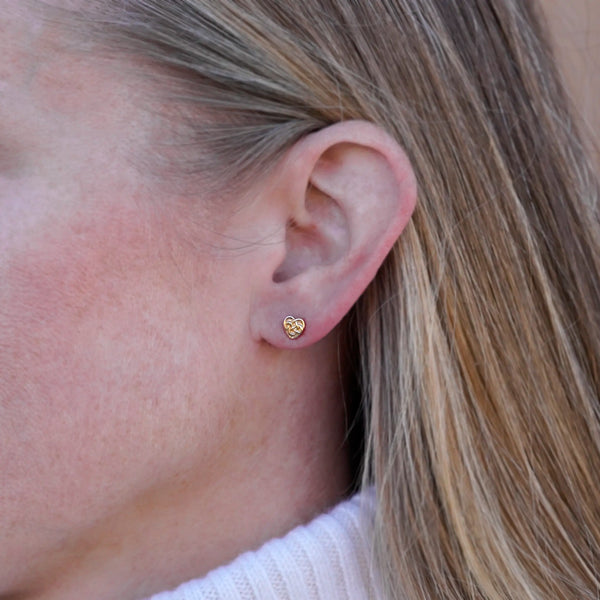 Robin's Heart post earring in 14K gold, worn on the ear