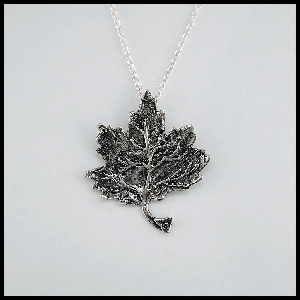 Trinity Knot Maple Leaf Pendant in Sterling Silver