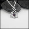 This lovely Limited Edition Trinity Knot Heart Pendant in Sterling Silver, set with 4mm Rhodolite Garnets. Includes 18" Cable Chain.