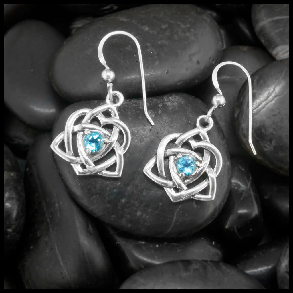Sterling Silver Trinity Heart  Earrings set with a 4mm Blue Topaz. This is a Limited Edition Set.