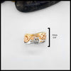 Tri-tone 14K Gold ring with interwoven design on a white background. Ring is approximately 10mm or 3/8".