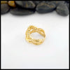 14K Yellow Gold ring with a detailed Scottish Thistle design on a white background with stones in the background