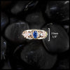 10mm face frame ring. Gold custom frame ring with rose gold, white gold, and yellow gold set with two diamonds and an oval blue sapphire