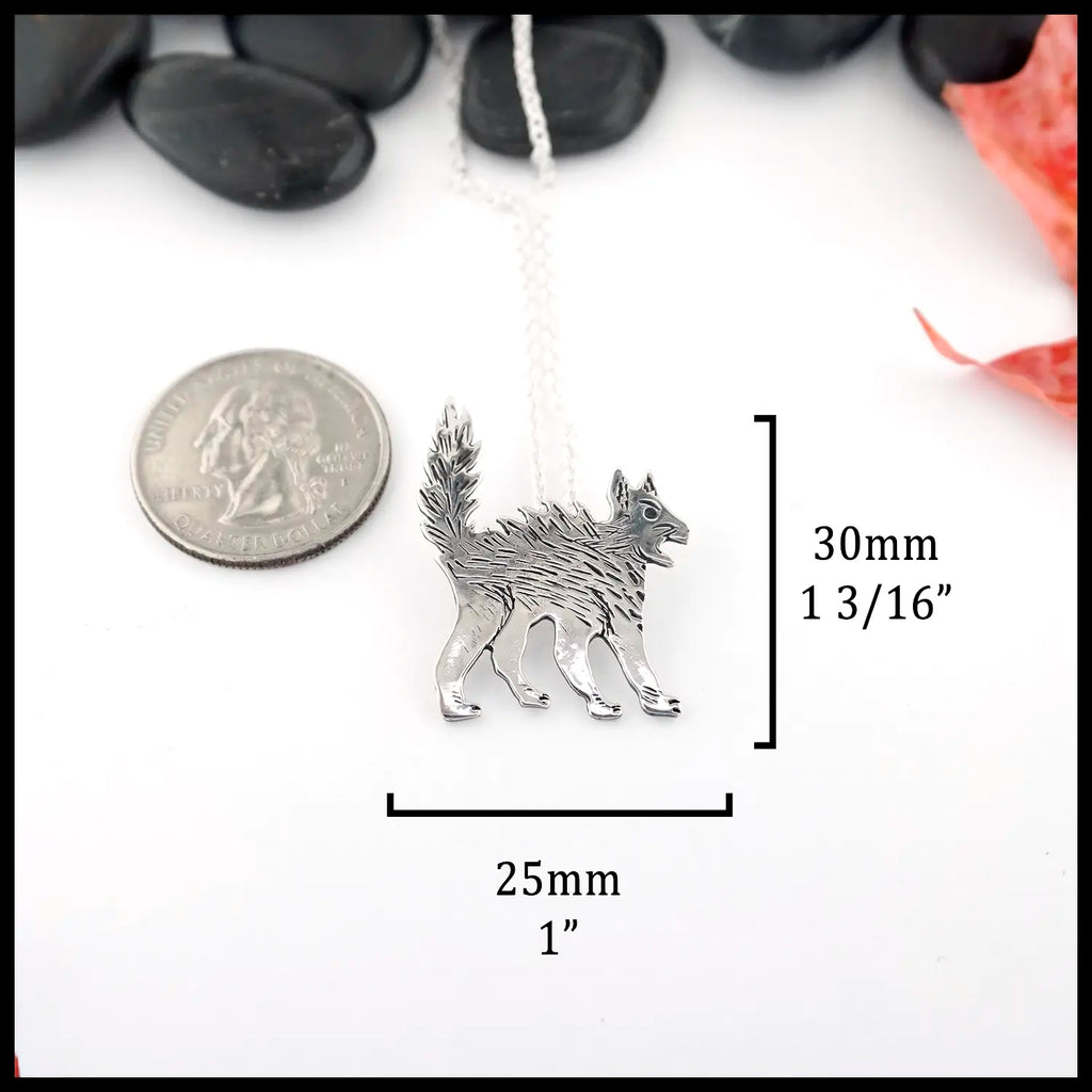 Silver Scaredy Cat necklace on a background. Measurements are: 30mm or 1 3/16" Tall and 25mm or 1" Wide.