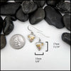 Triangle Sterling Silver Frame drop earrings with 18K yellow gold leaf accents and pink tourmalines.
Measure at 17mm x 15mm