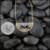 14K Yellow Gold frame pendant on an attached chain, featuring ceylon blue sapphires and 18K gold details. Measures at 17mx32mm