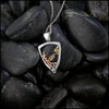 Silver Frame pendant with 14K rose gold oak leaves, 14K yellow gold spirals and beads. set with a 2mm ruby.