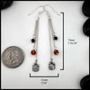 Pumpkin chained drop earrings in silver with beaded amber and onyx.
Measure at 73mm x 11mm