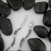 Spiral Trinity Scroll Link Bracelet, attached with a large lobster clasp and adjusting links