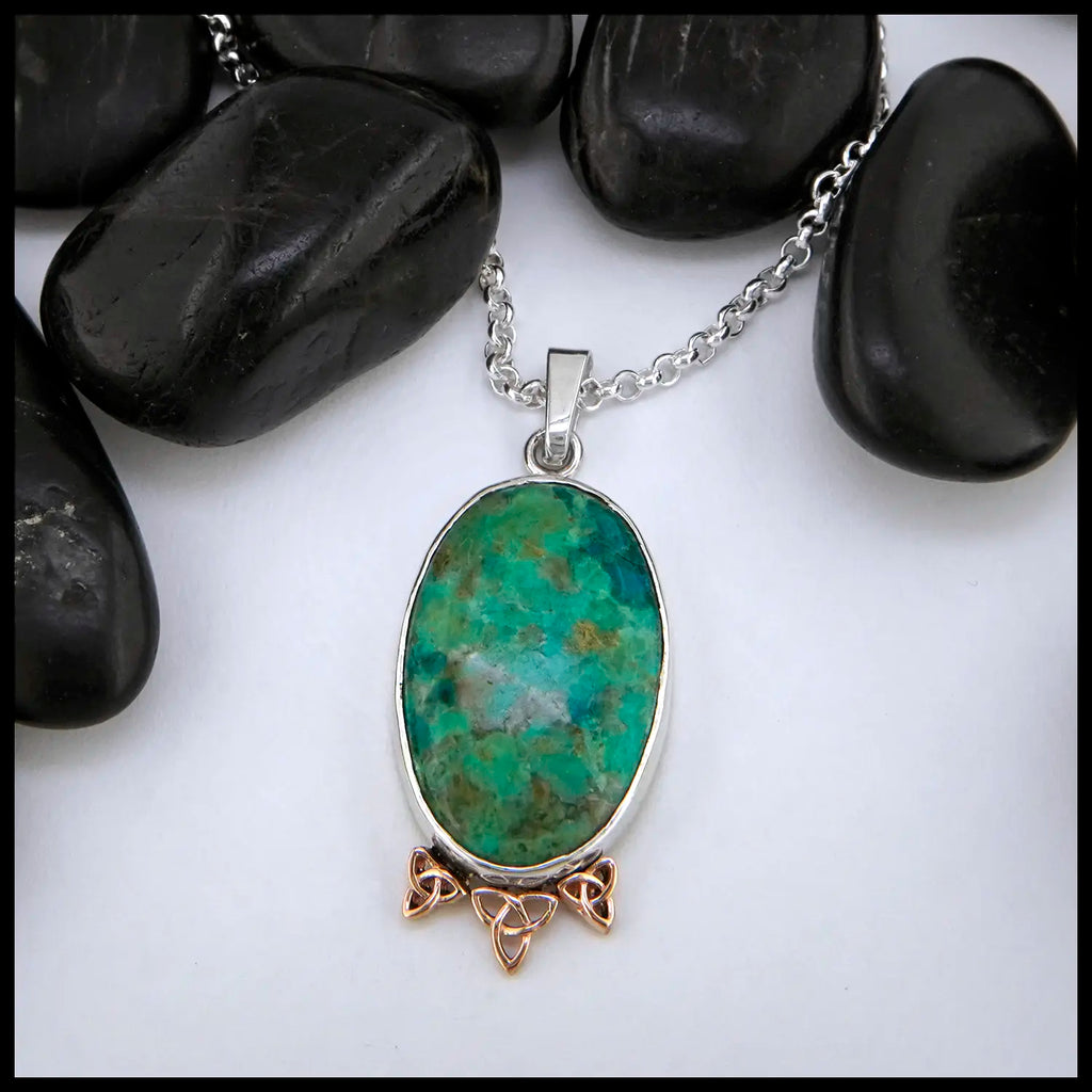 Chrysocolla oval cabochon set in sterling silver with Celtic accents