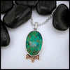 Chrysocolla oval cabochon set in sterling silver with Celtic accents