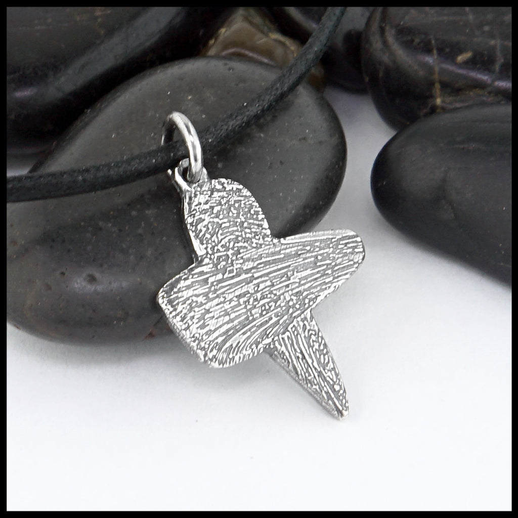 ash cross pendant on black cord 