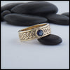 Josephine's Knot band in 14K Yellow gold with Blue Sapphire