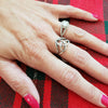 Trinity Knot ring in Sterling Silver with a cathedral profile as shown on the hand. 