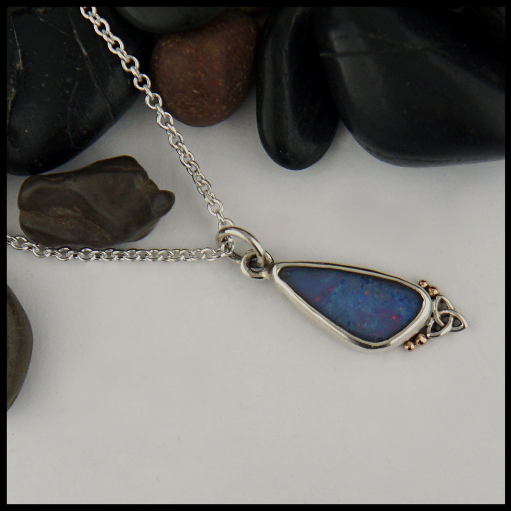 Custom Asymmetrical Sterling Silver pendant with 14K Rose Gold details with a bezel set gray Opal.