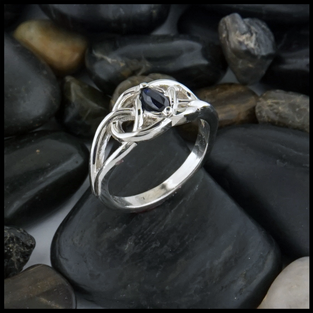 This 14K white gold ring is set with a 6X3 Marquise Sapphire stone. 