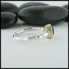 Profile view of rose cut blue tourmaline ring in silver and gold