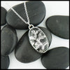 Custom hand-fabricated pendant in Sterling Silver with one of a kind Rutilated Quartz and hand-pierced vine design with 18K yellow gold details on the back.  Vine design visible through the stone.