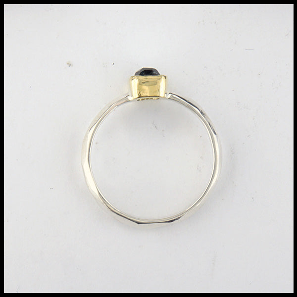 Profile view of rustic hand fabricated ring in sterling silver with an 18K yellow gold bezel set with a Rose Cut Blue Green Tourmaline.