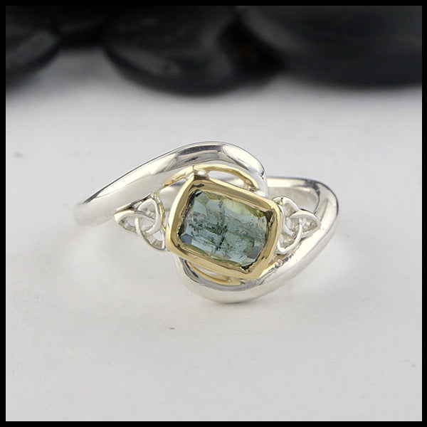 Rustic hand fabricated ring in sterling silver with an 18K yellow gold bezel, set with a Rose Cut  Green Tourmaline with trinity knot accents.