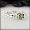 Rustic hand fabricated ring in sterling silver with an 18K yellow gold bezel, set with a Rose Cut Mint Green Tourmaline.