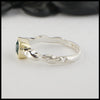 Side view of rustic hand fabricated ring in sterling silver with an 18K yellow gold bezel, set with a Rose Cut Mint Green Tourmaline.