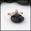 14K Rose gold chevron stacking band with ten 1.5mm diamonds with a 14K white gold trinity knot. 