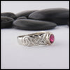 profile view of custom ban tigherna ring in white gold with ruby