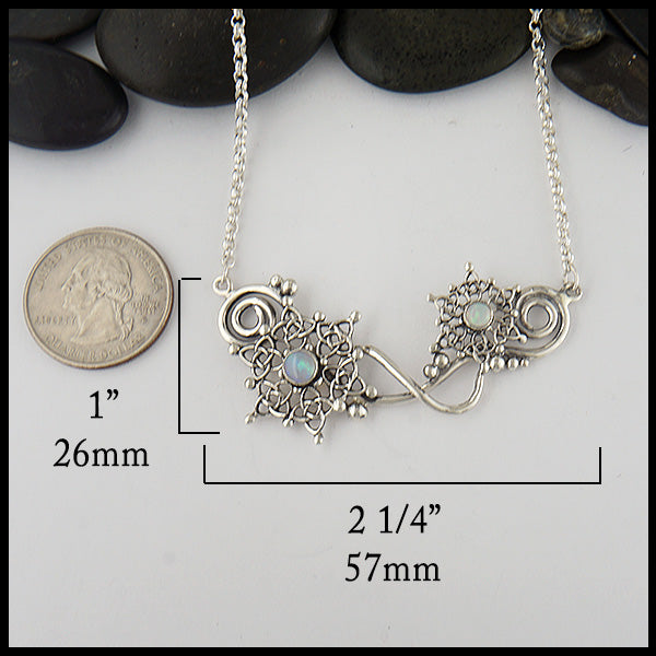Pendant measures 1" by 2 1/4"