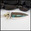 Profile view of custom Opal pendant in Sterling Silver and 18K Yellow Gold set with an accented oval tourmaline