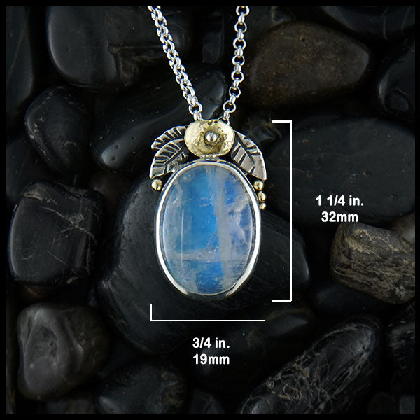 Pendant is 1 1/4 inch long by 3/4 inch wide
