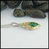 Profile view of Custom Ivy pendant in 14K White gold and 18K yellow gold with Tsavorite