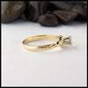Profile view of Trinity knot ring with reclaimed diamond