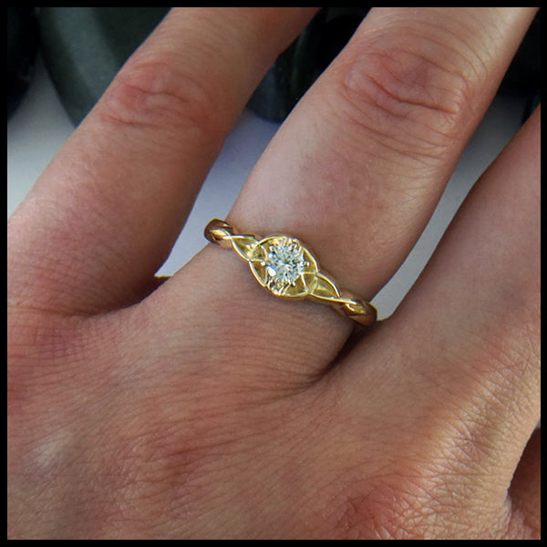 Trinity knot ring with reclaimed diamond