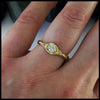 Trinity knot ring with reclaimed diamond