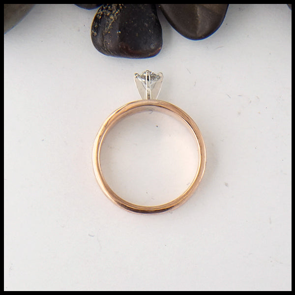 Profile view of Celtic knot ring with reclaimed diamond