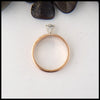 Profile view of Celtic knot ring with reclaimed diamond