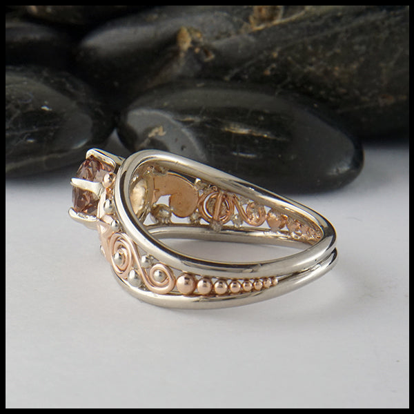 Profile view of Malaya Garnet ring in 14K Rose and white gold