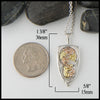 Pendant measures 1 3/8" by 5/8"