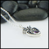 profile view of luckenbooth pendant with amethyst