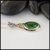 Profile view of Chrome Diopside Pendant with 18K Yellow Shamrock