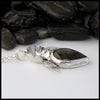 Profile view of Custom Sterling Silver and 14K Rose Gold Floral Pendant with Labradorite