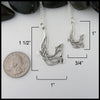 Large Otter dimensions 1 1/2 inch long by 1 inch wide.  Small Otter 1 inch long by 3/4 inch wide