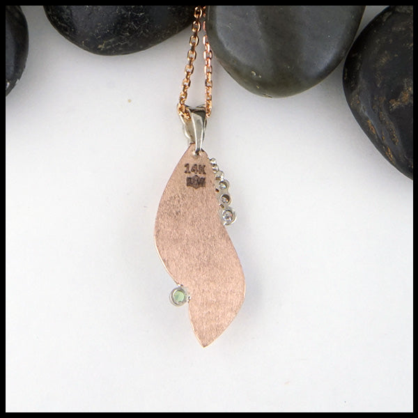 back view of custom opal and rose gold pendant